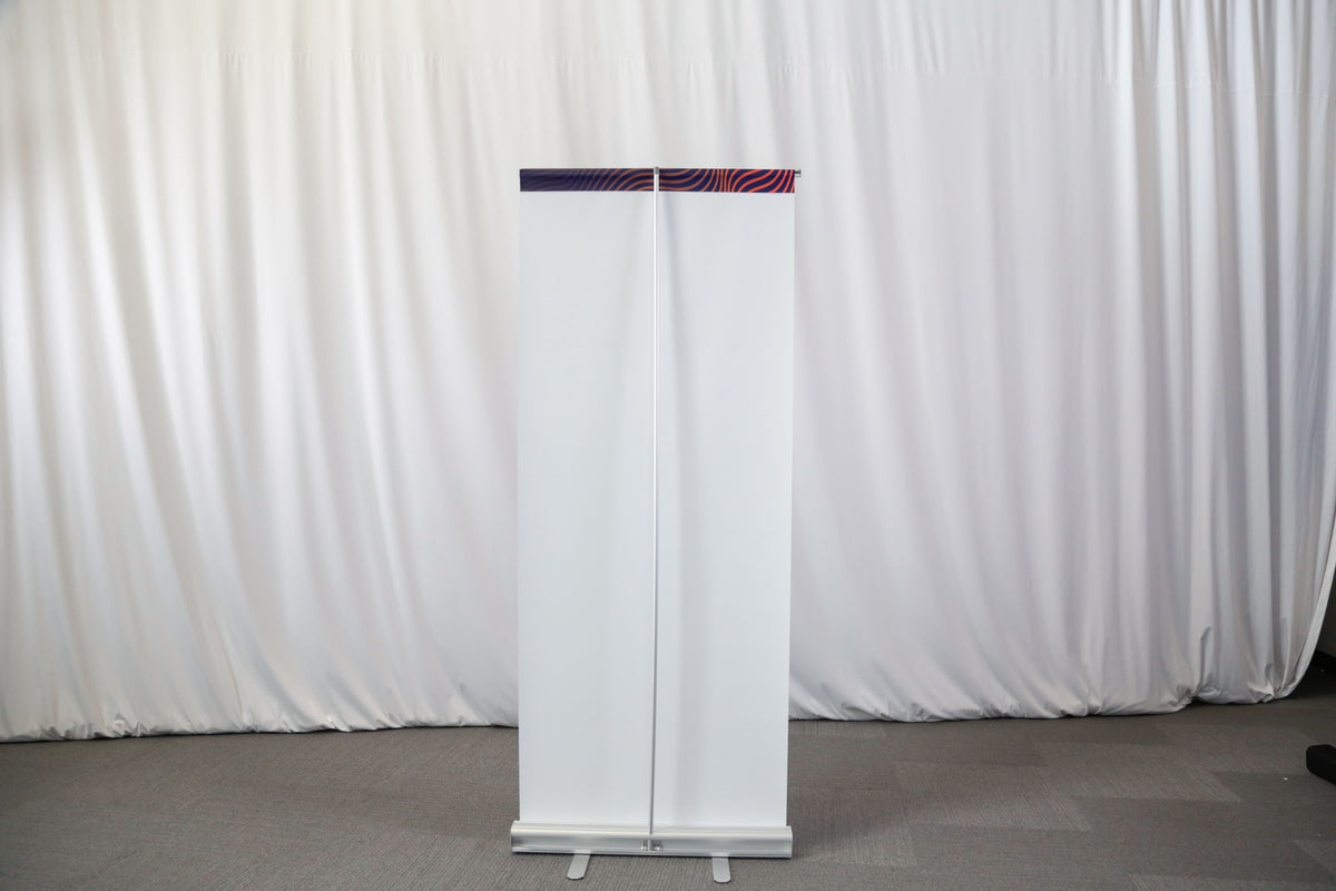 Entry-level retractable banner stand with spring-loaded aluminum base
