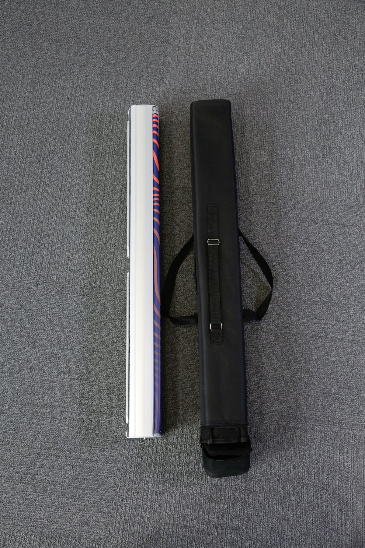 Entry-level retractable banner stand with spring-loaded aluminum base