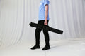 Entry-level retractable banner stand with spring-loaded aluminum base