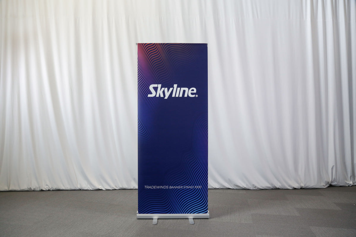 Entry-level retractable banner stand with spring-loaded aluminum base