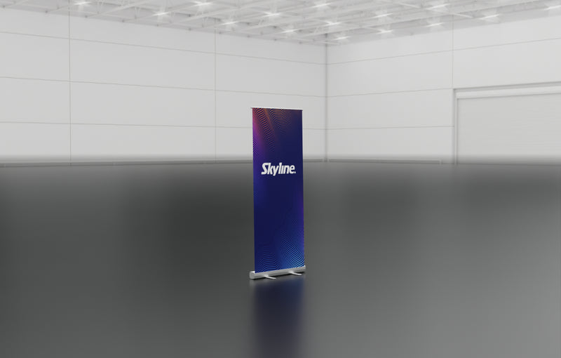Entry-level retractable banner stand with spring-loaded aluminum base