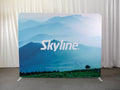 10-foot straight backwall display with aluminum frame and single-sided pillowcase graphic